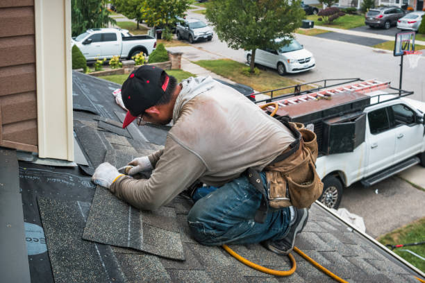 Professional Roofing technician working in Bellport, NY